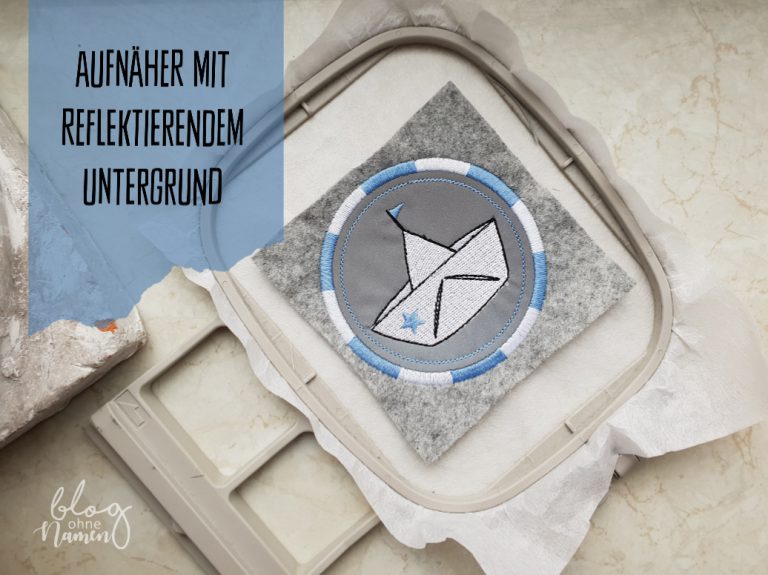 Aufnäher mit reflektierendem Untergrund – Stickerei auf reflektierendem Gewebe und Bügelfolie